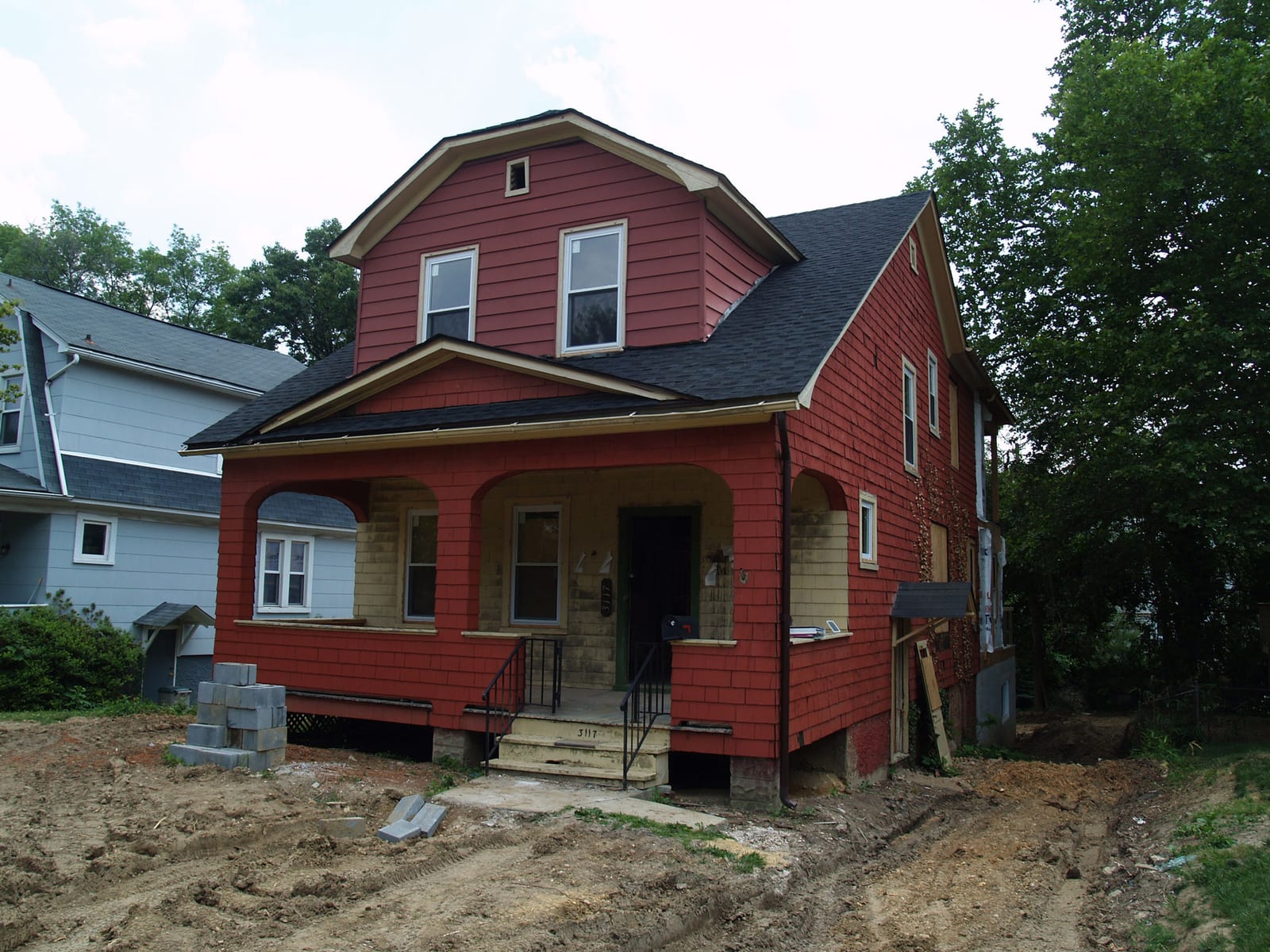The 1928 bungalow part-way through the rebuild, with a new roof over the porch